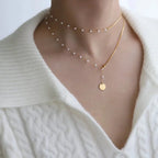 Collier superposé à chevrons et perles