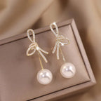 Boucles d'oreilles pendantes nœud et perle