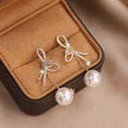 Boucles d'oreilles pendantes nœud et perle