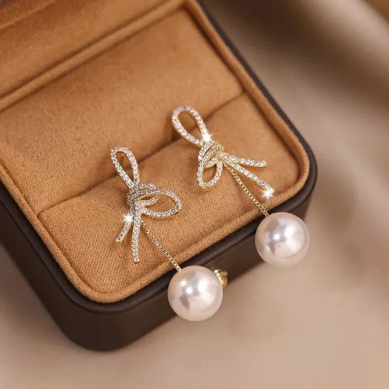 Boucles d'oreilles pendantes nœud et perle