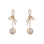 Boucles d'oreilles pendantes nœud et perle
