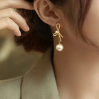Boucles d'oreilles pendantes nœud et perle