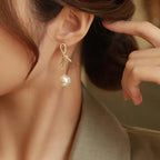 Boucles d'oreilles pendantes nœud et perle
