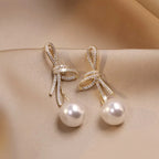 Boucles d'oreilles pendantes nœud et perle