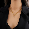 Collier superposé avec fermoir cercle et perle