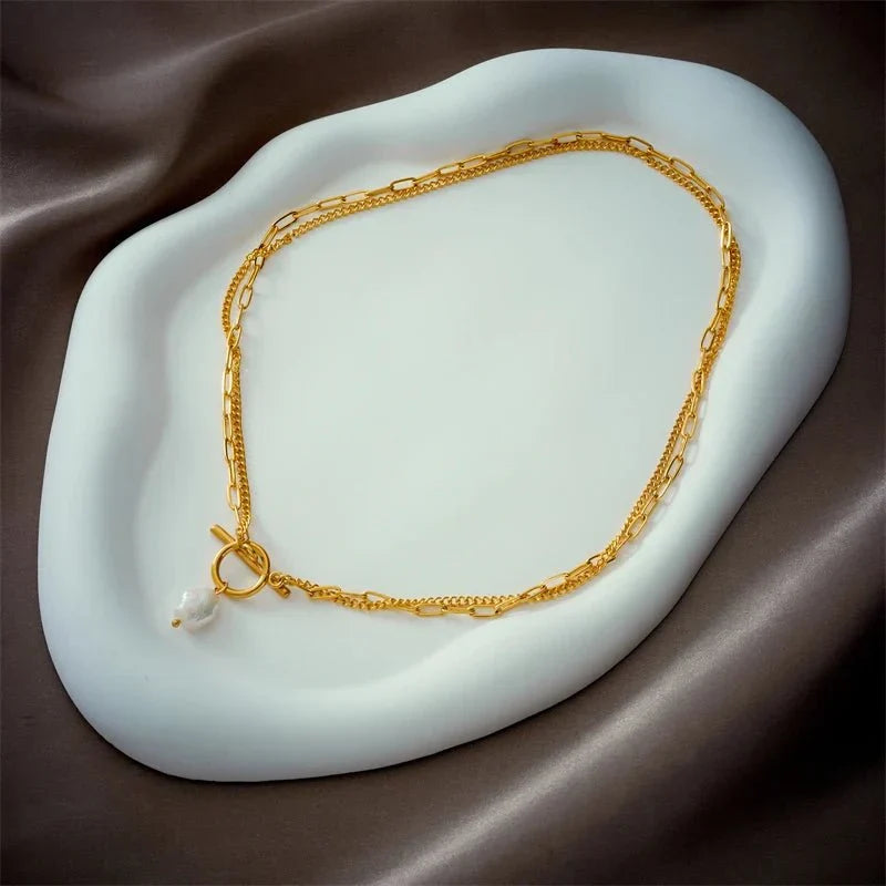 Collier superposé avec fermoir cercle et perle