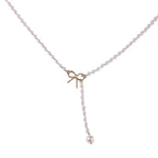 Collier lariat avec perles et nœud délicat