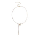 Collier lariat avec perles et nœud délicat