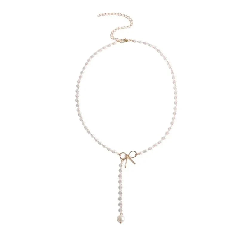 Collier lariat avec perles et nœud délicat