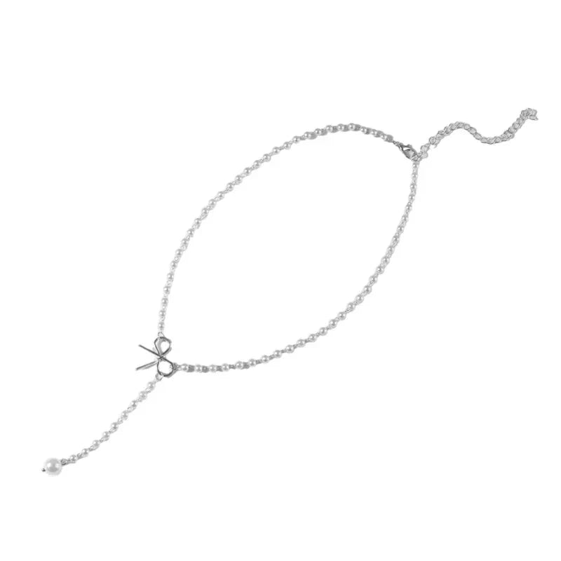 Collier lariat avec perles et nœud délicat