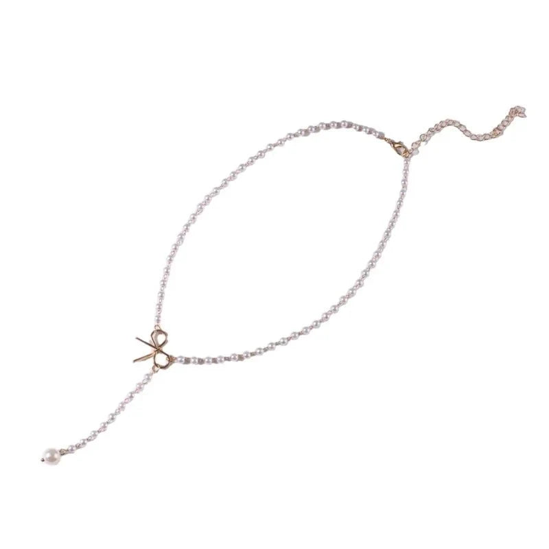 Collier lariat avec perles et nœud délicat