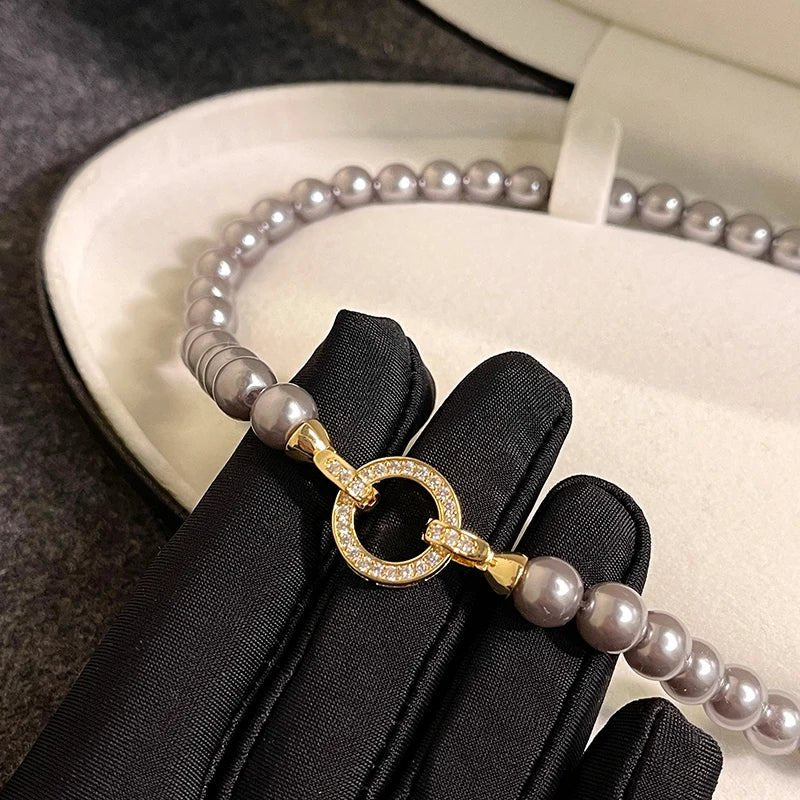 Parure bracelet et collier pendentif cercle perle et diamant