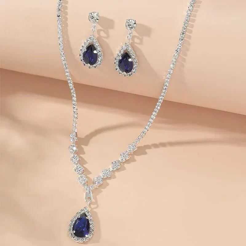 Parure collier et boucles d'oreilles goutte bleue scintillante