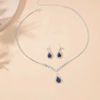Parure collier et boucles d'oreilles goutte bleue scintillante