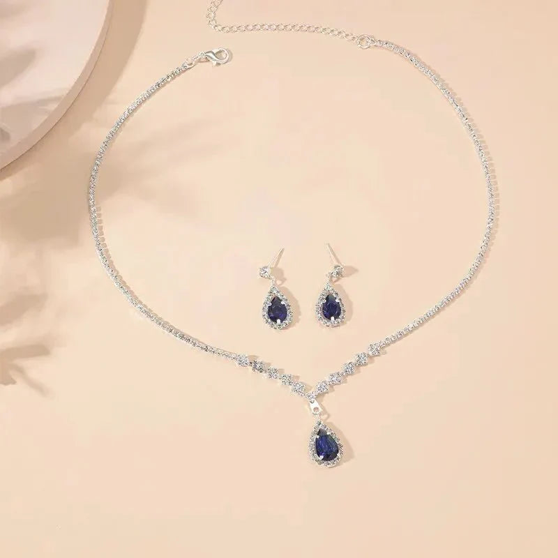 Parure collier et boucles d'oreilles goutte bleue scintillante